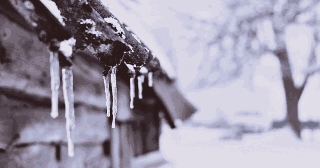 icicles hanging off roof edge in winter